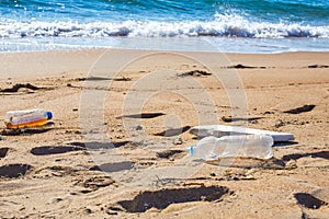 Plastic trash on the seashore. Environmental pollution. Ecological catastrophy photo