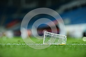 Plastic trash on the turf on a soccer field