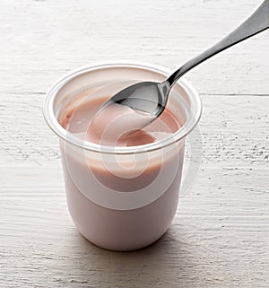 Plastic tub of healthy fruit yoghurt