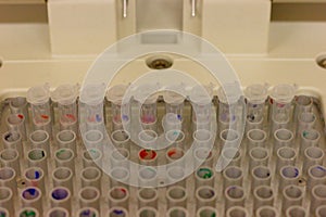Plastic tubes in a thermocycler used for PCR polymerase chain reaction photo