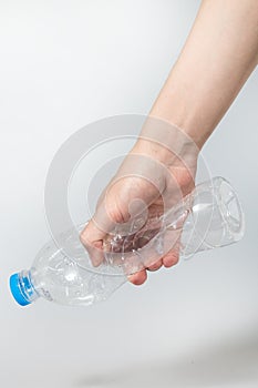 Plastic twist bottle in hand