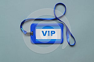 Plastic vip badge on light background, top view