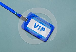 Plastic vip badge on light background, top view