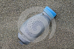 Plastic waste bottle on beach