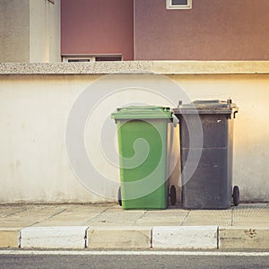 Plastic waste containers on the street ready for collection