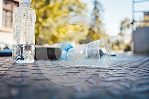 Plastic waste on the floor in aftermath of a party