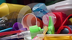 Plastic waste recycle. A pile of plastic garbage, tubes from drinks, disposable tableware, food drink and household