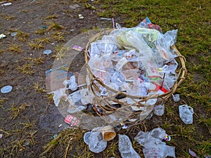 Trash can full of plastic waste photo