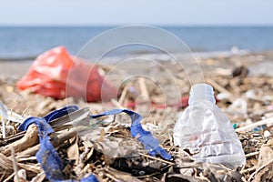 Plastic Waste and Trash on Sandy Beach. Environmental Pollution Problem Concept.