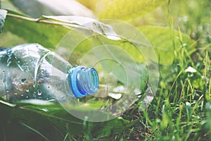 Plastic water bottle waste, forest litter