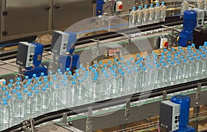 Plastic water bottles on conveyor