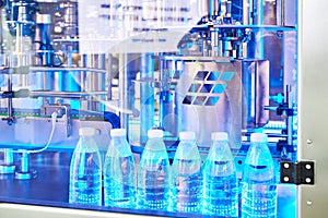 Plastic water bottles on packaging conveyor