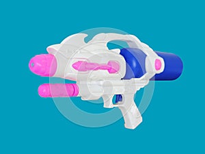 Plastic water gun isolated on blue background