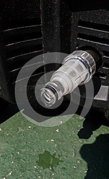 plastic water hose adopter or connector of a high pressure washer for cars photo