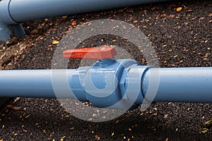 Plastic water supply pipes with valve for adjustment close-up