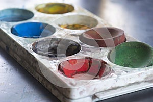 Plastic watercolor palette box with cracked paint