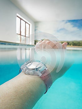 Plastic waterpoof watch underwater in a swimming pool