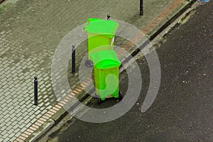 Plastic wheely bins in the street outside