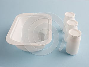 Plastic white bank and three white banks with lids