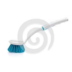 Plastic white brush with felted bristles for cleaning debris isolated on white background. Household products.