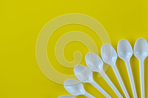 Plastic white spoons. Disposable utensils
