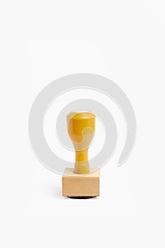 A plastic and wooden stamp isolated on a white background