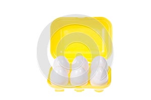 Plastic yellow box with 6 eggs