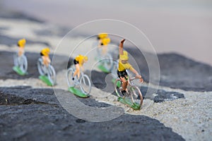 Plastic yellow road cyclists outdoor. V shape. Competition. Peloton.