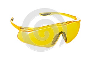 Plastic yellow safety goggles for work isolated on white background