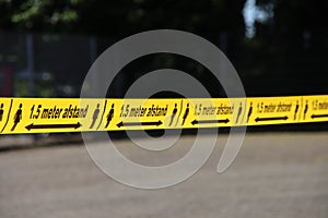 Plastic yellow tape with in dutch language 1,5 meter Afstand to keep people o