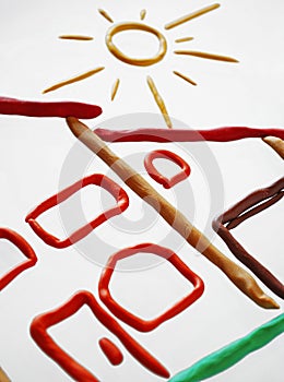 Plasticine cottage and sun