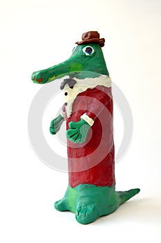 Plasticine figure Gena`s Crocodile on a white background. Children`s creativity photo