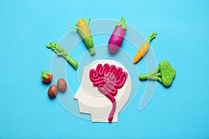 Plasticine figure of man and vegetarian food. Food for mind, charge of energy. Healthy lifestyle, detoxification and antioxidants