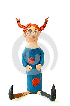 Plasticine figure of Pippi Longstocking on a white background. Children`s creativity