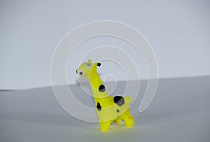 Plasticine giraffe. Plasticine toys on white background
