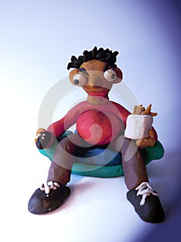 Plasticine man watching TV