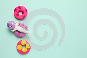 Plasticine people relaxing on inflatable donut lilo in pool. Cartoon summer relaxing and holidays