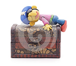 Plasticine pirate on treasure chest.