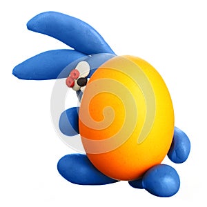 Plasticine rabbit with easter egg