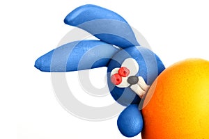 Plasticine rabbit with easter egg