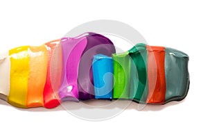 Plasticine set isolated on white. Colorful rainbow. The colors were mixed. Bright background