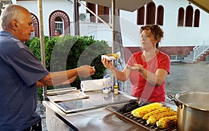 PLATAMONAS, GREECE - JUNE 29, 2018: Street seller of boiled and grilled corn on Platamonas,Greece.