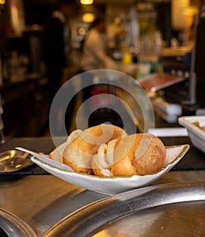 A plate with 2 squid sandwiches. Typical Madrid sandwich