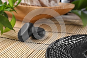 Plate with acupuncture needles