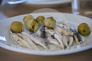 A plate of Anchovies and Olives.