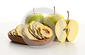 Plate with apple chips and fresh apples