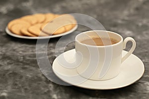 Plate of arrowroot biscuits on a rustic background.