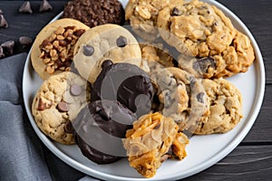 plate of assorted cookies, including chocolate chip, oatmeal raisin and peanut butter