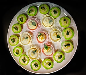 A plate of assorted cupcakes