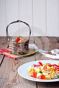 Plate and basket with colorful sweet candies
